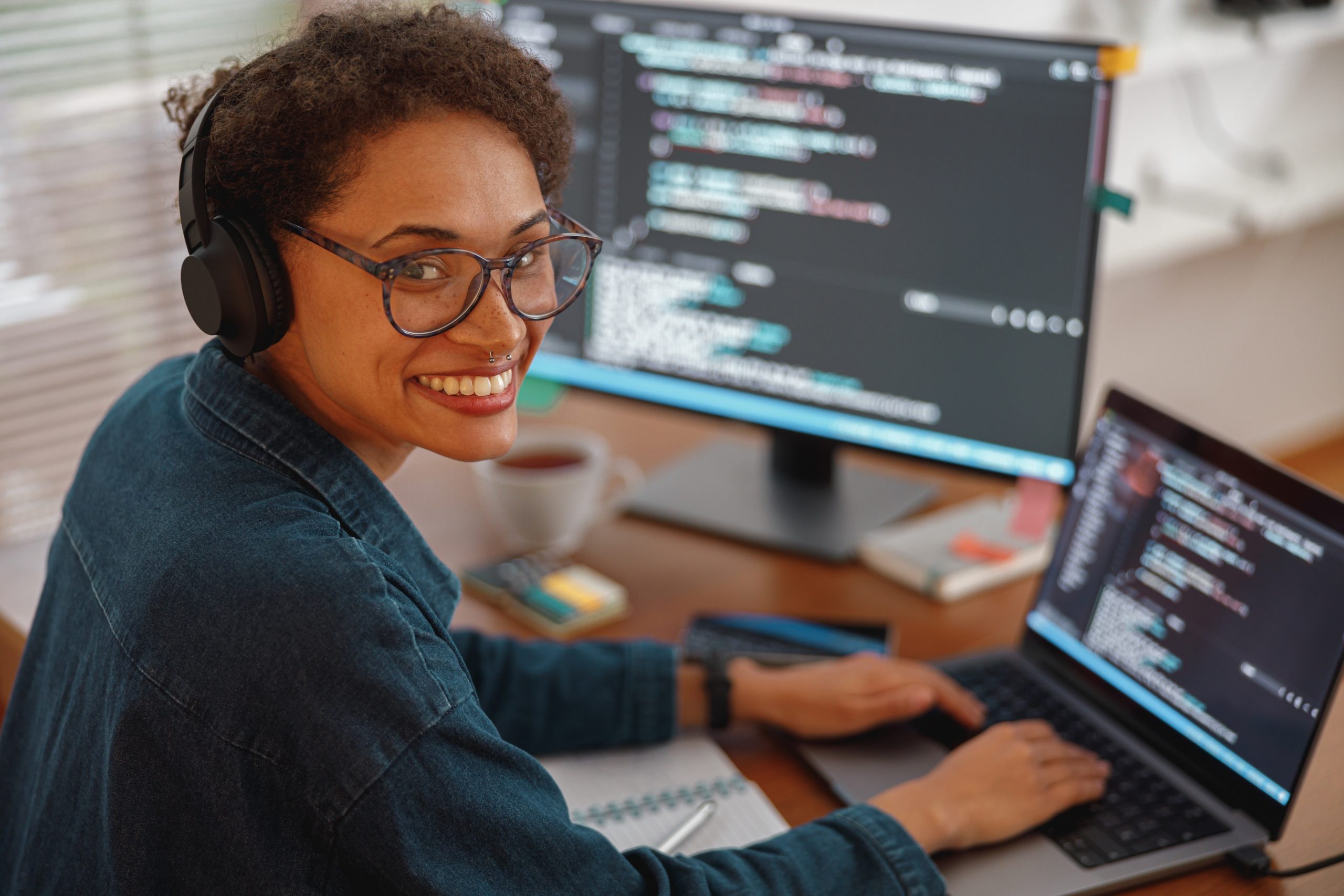 Woman in headphones freelance data scientist work remotely at home. High quality photo